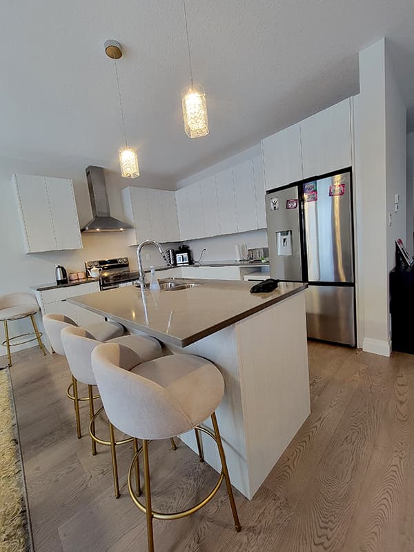 Finished white IKEA kitchen cabinet installation